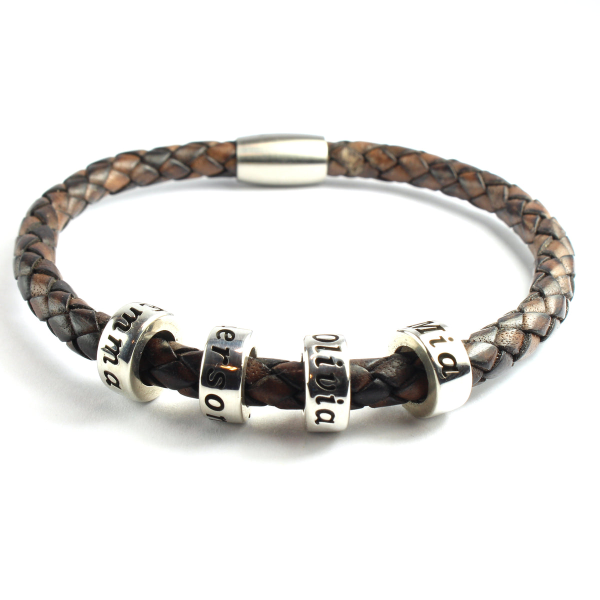 An antique brown genuine leather braided bracelet with 4 personalized sterling silver beads, on a white background