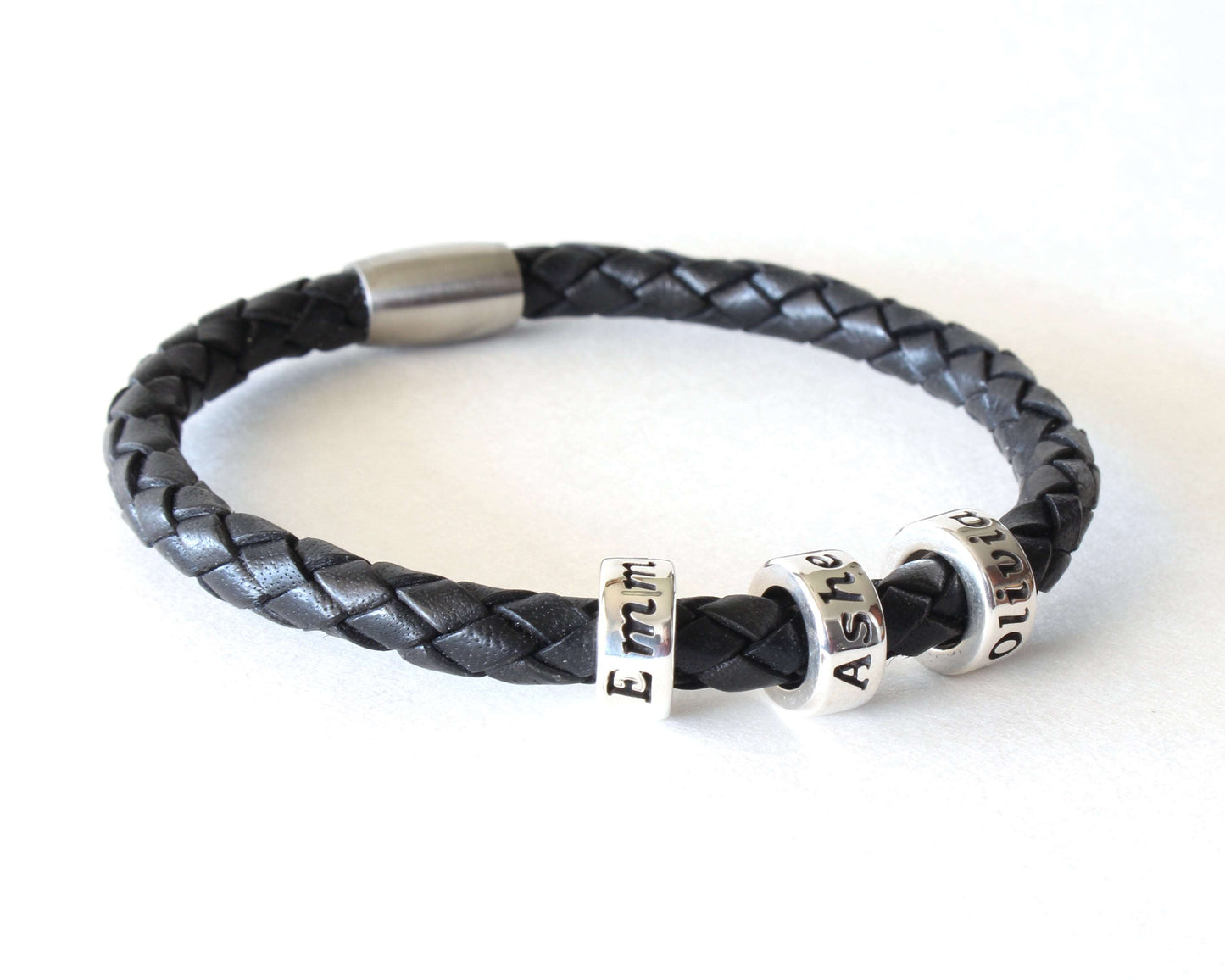 Black Genuine Leather Braided Custom Bracelet with 3 beads on white background