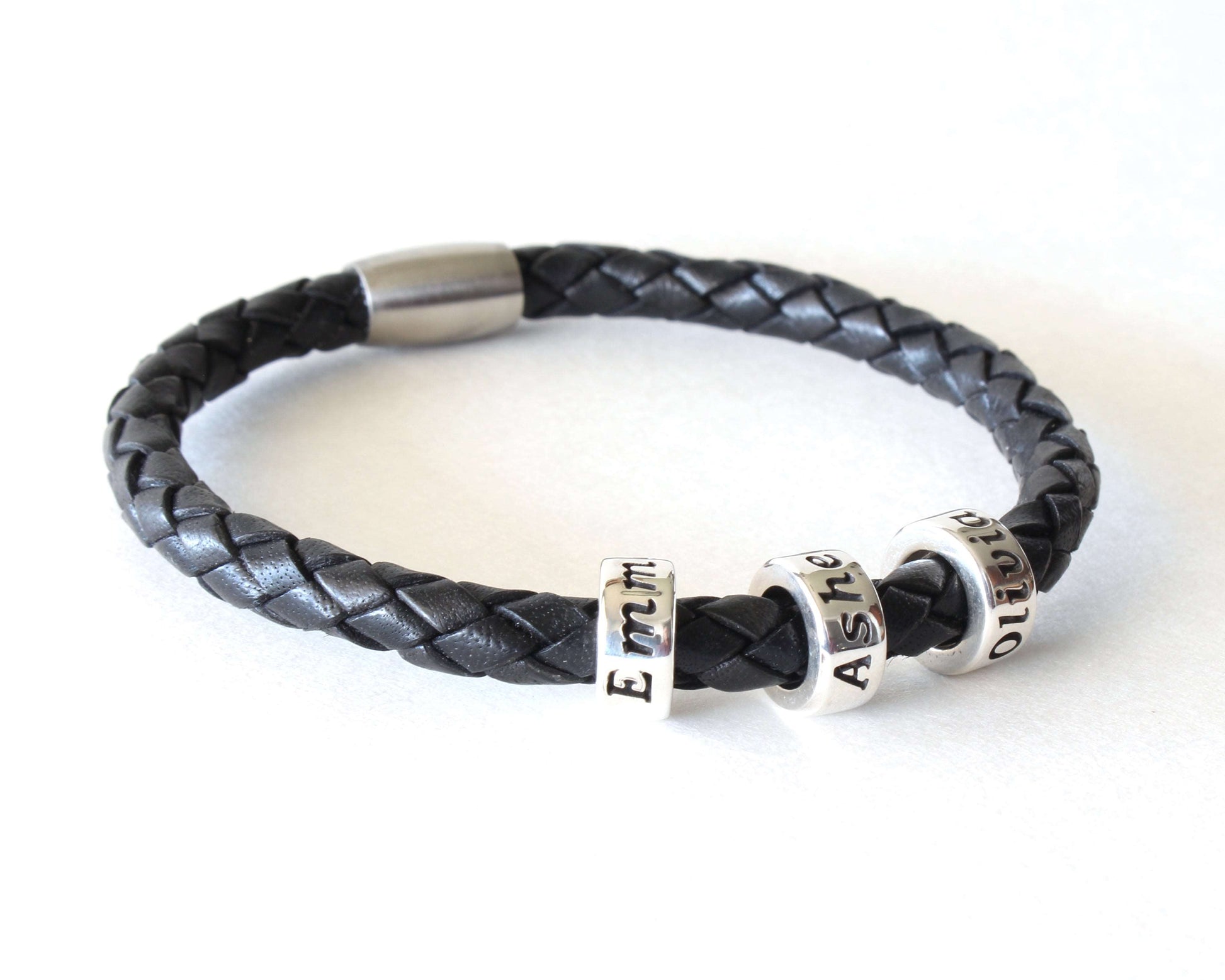 Black Genuine Leather Braided Custom Bracelet with 3 beads on white background