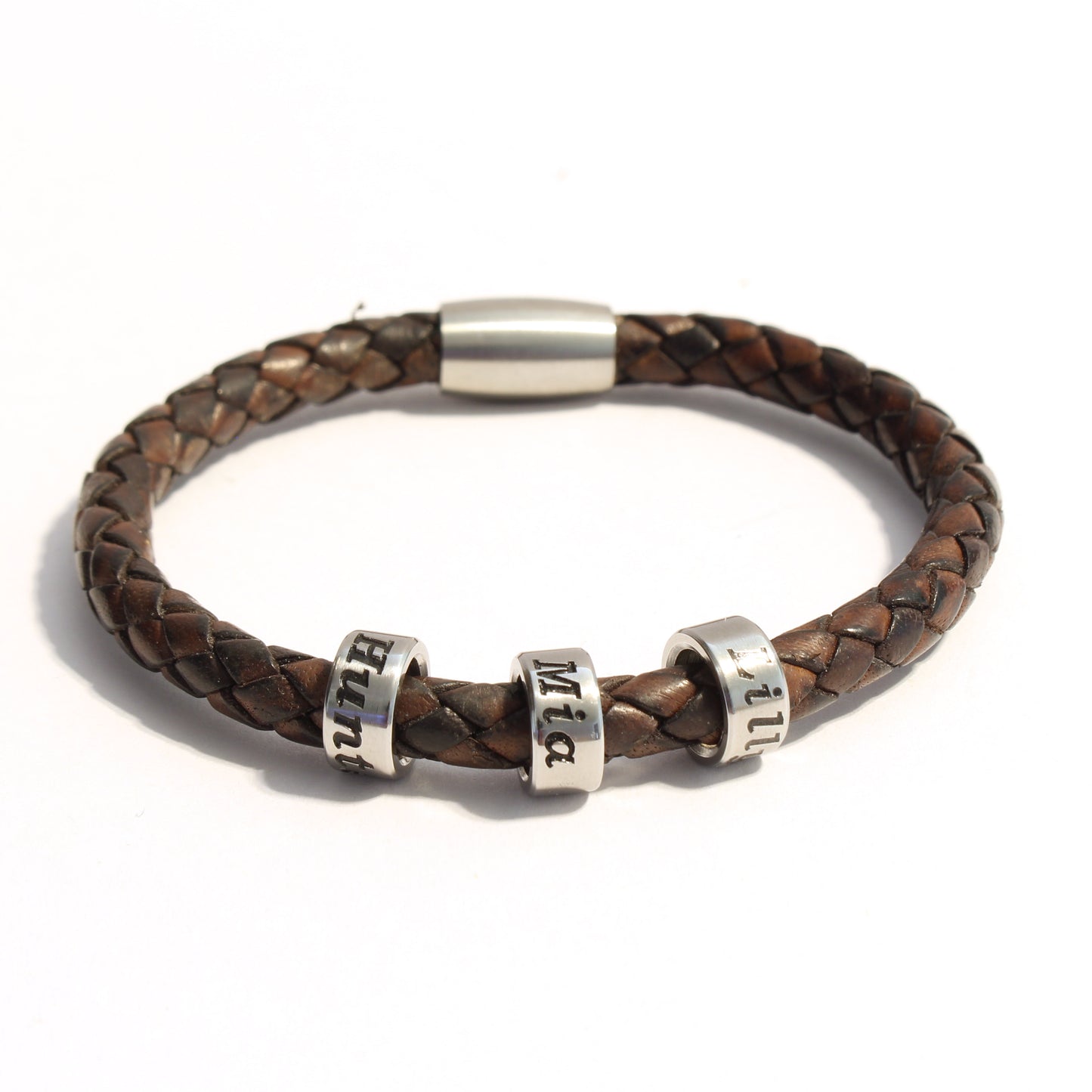 Antique Brown bolo braided leather bracelet with 3 stainless steel beads on a white background