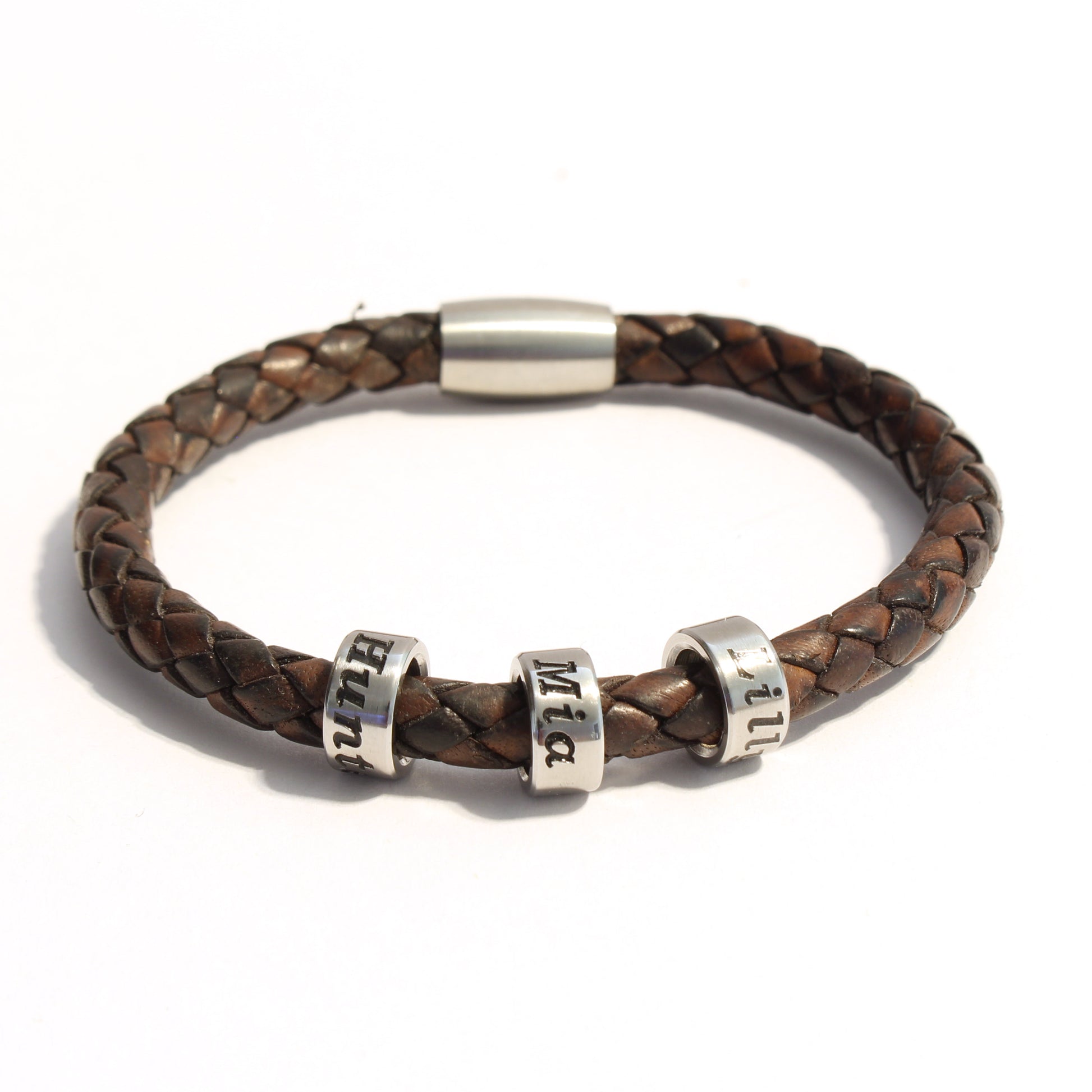 Antique Brown bolo braided leather bracelet with 3 stainless steel beads on a white background