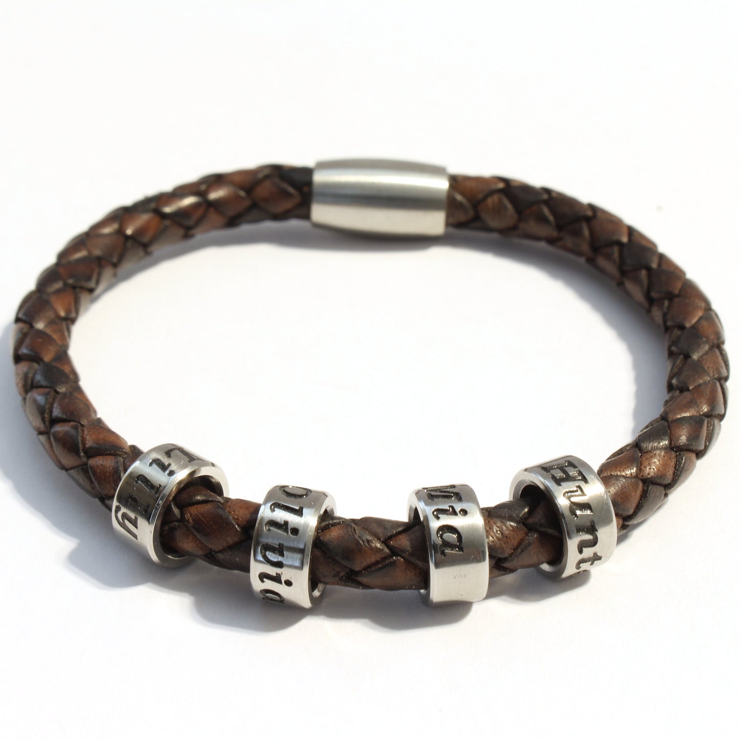 Antique Brown bolo braided leather bracelet with 4 stainless steel beads on a white background