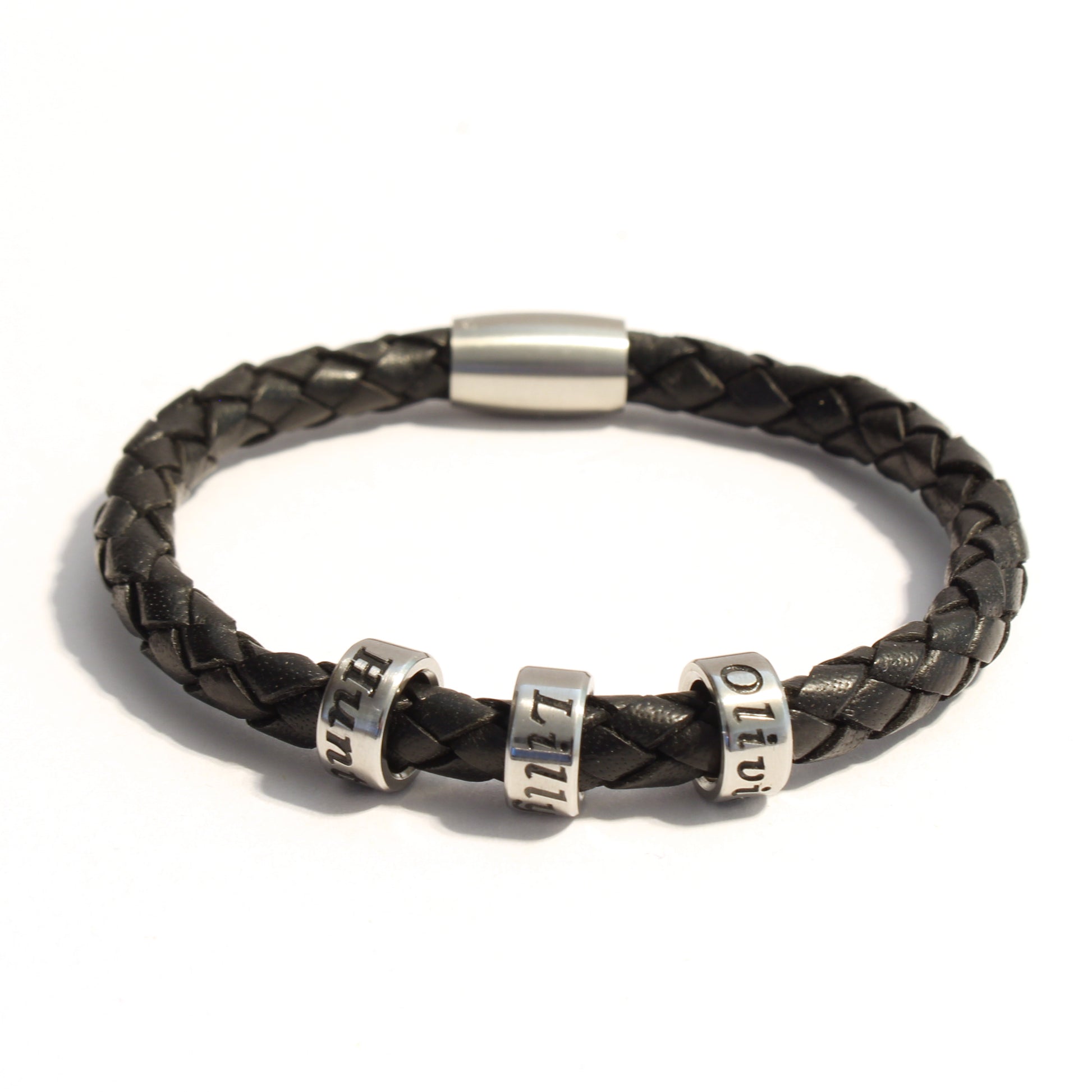 Black braided bolo leather bracelet with 3 stainless steel beads on a white background