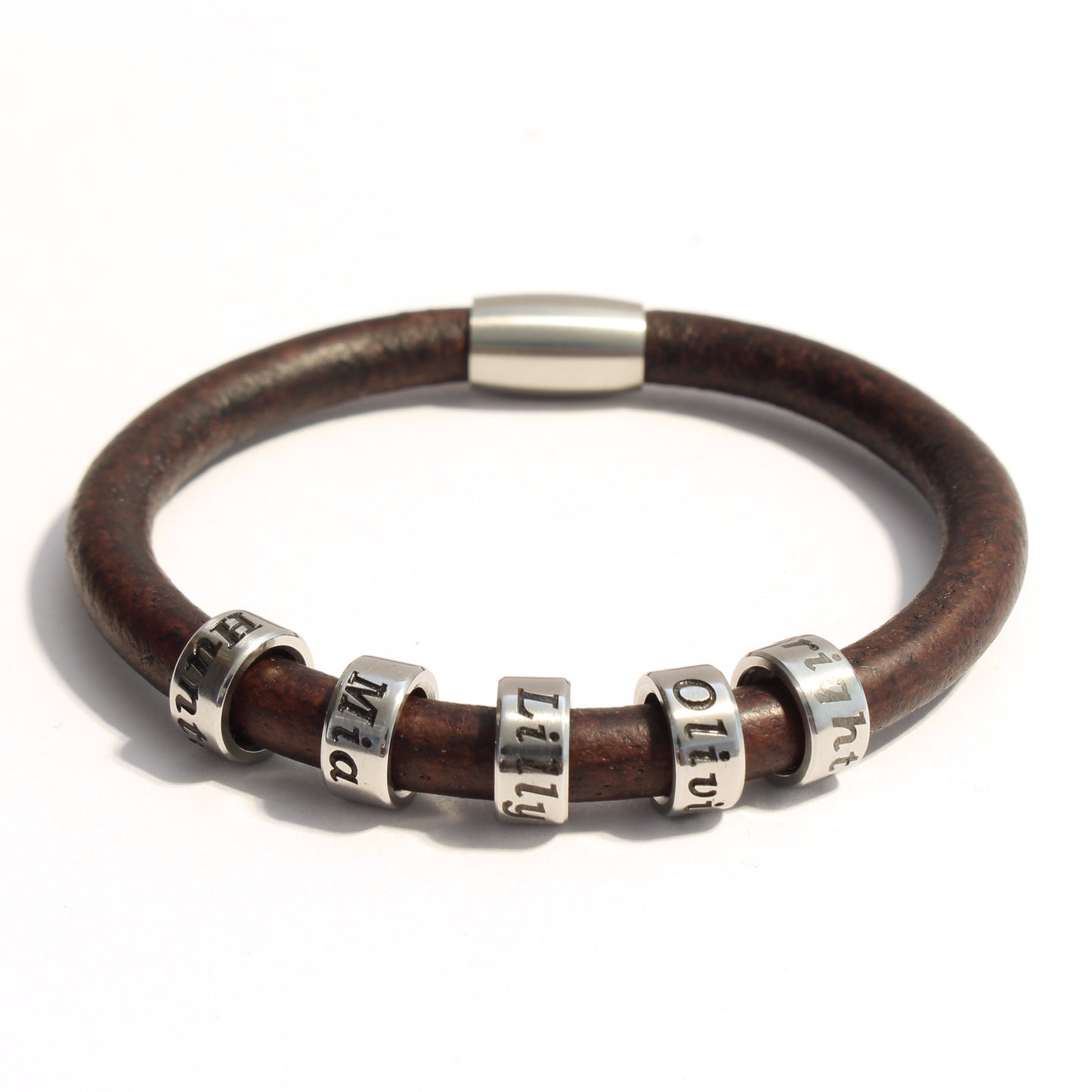 Brown leather bracelet with 5 stainless steel cylindrical beads on a white background