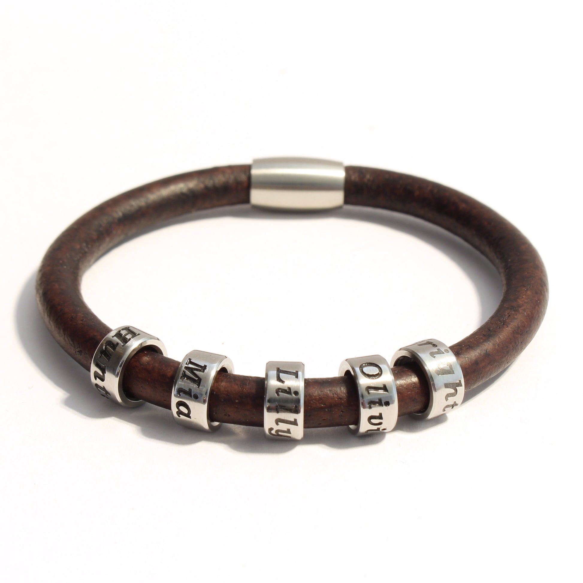 Brown leather bracelet with 5 stainless steel cylindrical beads on a white background