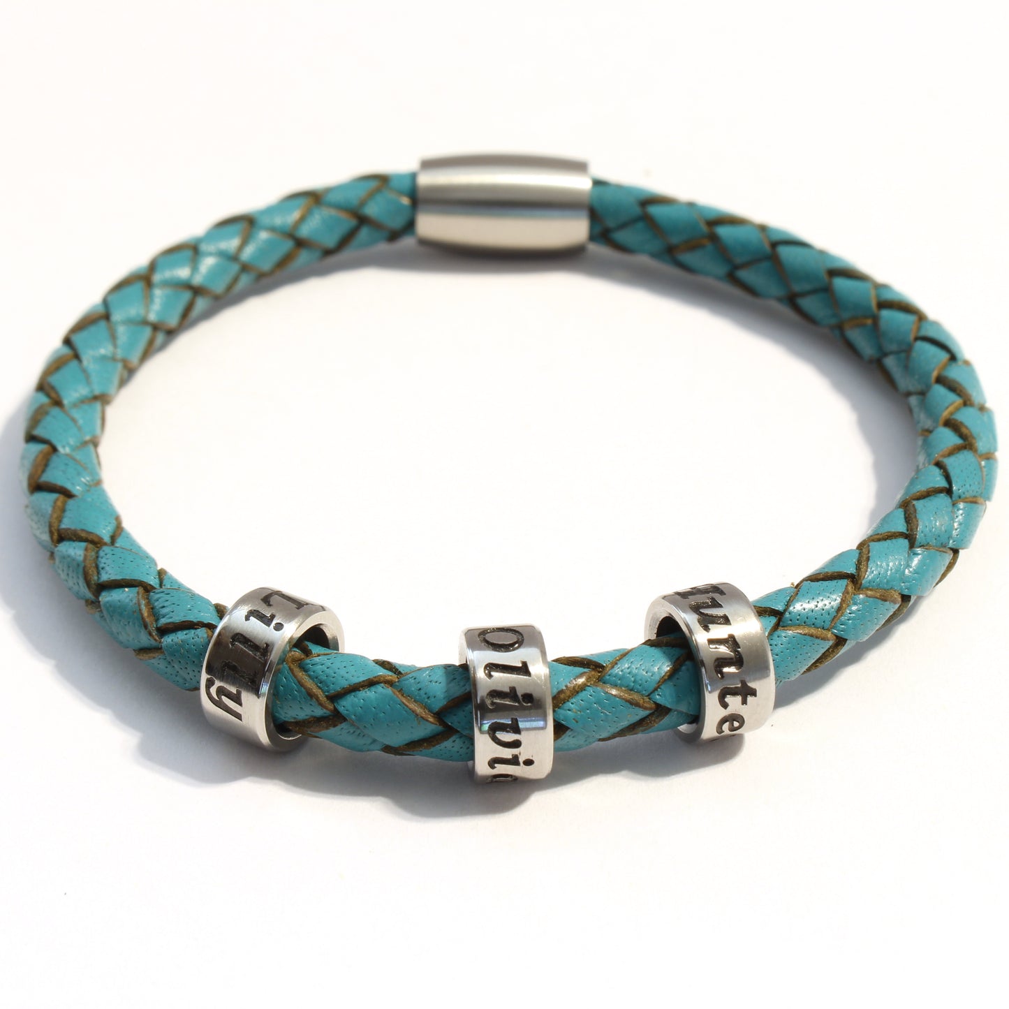 Turquoise braided leather bracelet with 3 stainless steel beads on a white background