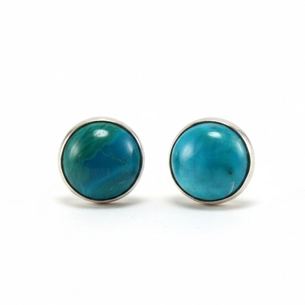 Pair of turquoise stud earrings on a white background