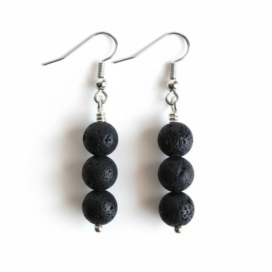Black beaded earrings on a white background