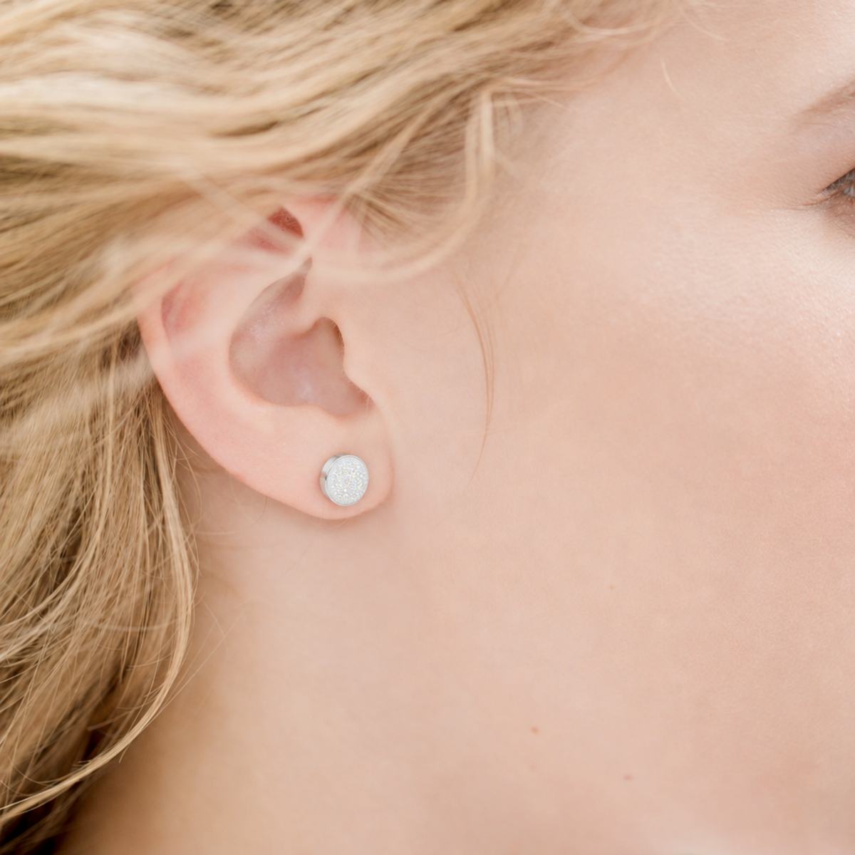 Model wearing sterling silver and white druzy stud earring