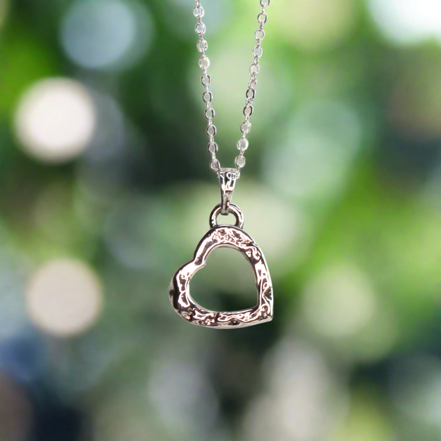 Small sterling silver heart necklace with textured finish