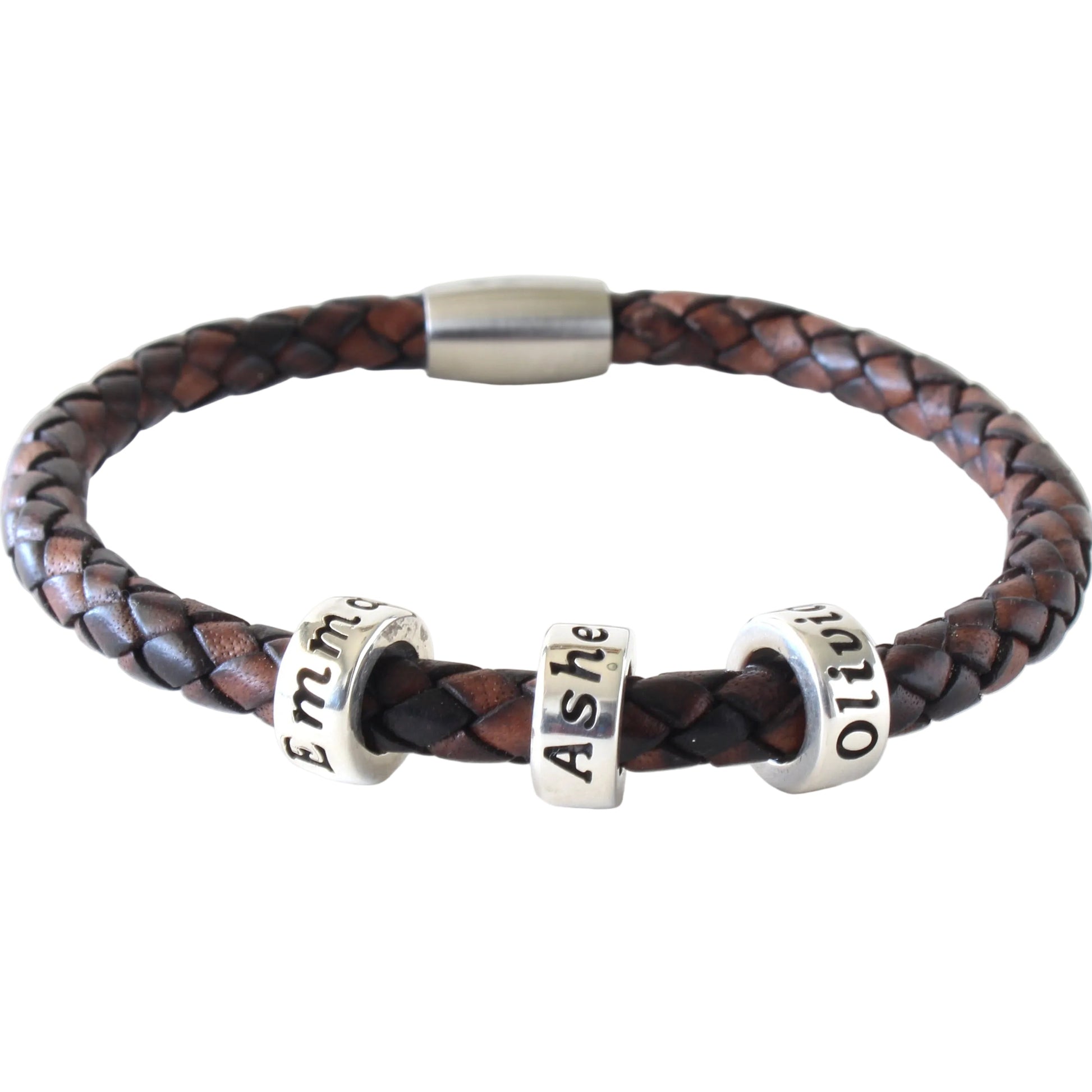 An antique brown genuine leather braided bracelet with personalized sterling silver beads, with a white background