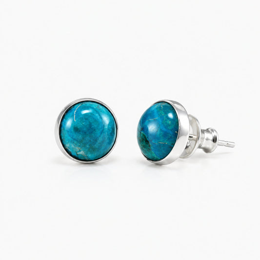 A pair of silver stud earrings with round cabochon Chrysocolla gemstones, shown on a clean white background.